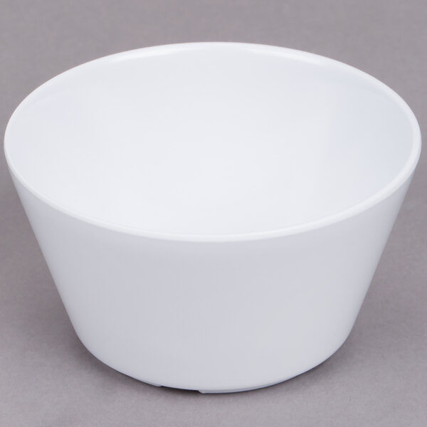 A white Thunder Group Nustone melamine bouillon bowl on a gray surface.