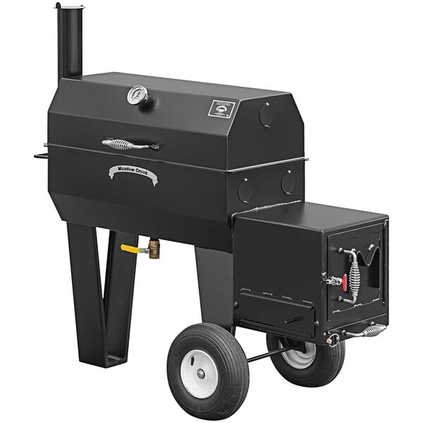 A black Meadow Creek SQ36 barbecue smoker on wheels.