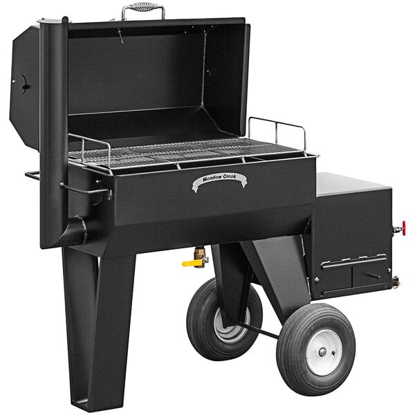 A black Meadow Creek barbecue smoker with a lid and wheels.