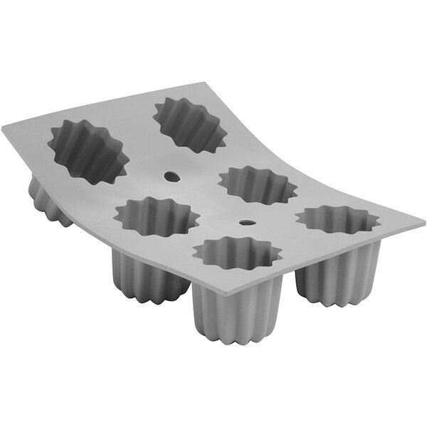 A white de Buyer silicone baking mold tray with 6 cannele molds.