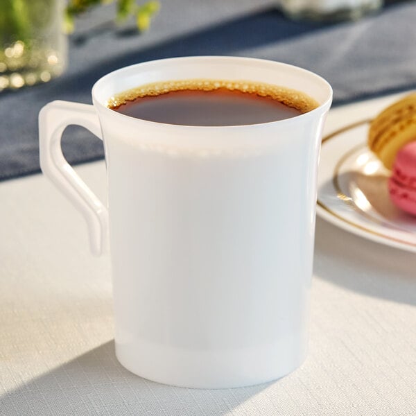 A white plastic coffee cup filled with coffee.