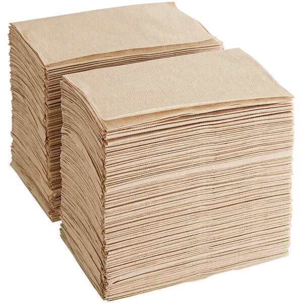 A stack of Tork natural kraft interfold dispenser napkins.
