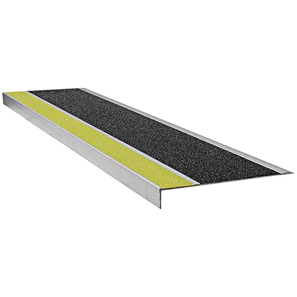 A Wooster Flexmaster black and yellow stair tread with a yellow strip.