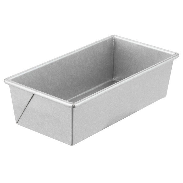 A silver Chicago Metallic bread loaf pan on a white counter.