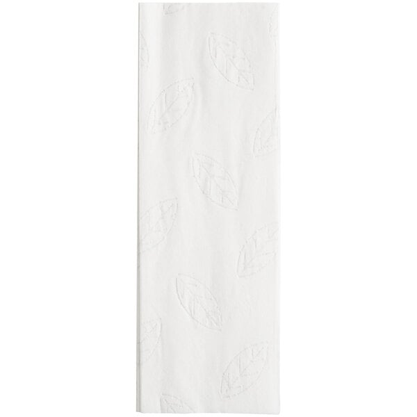 A white paper towel with a leaf pattern on it.
