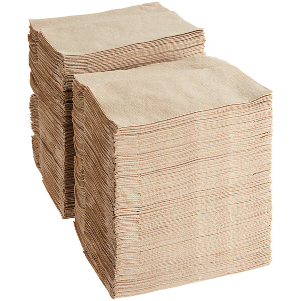 A stack of Tork natural kraft dispenser napkins.