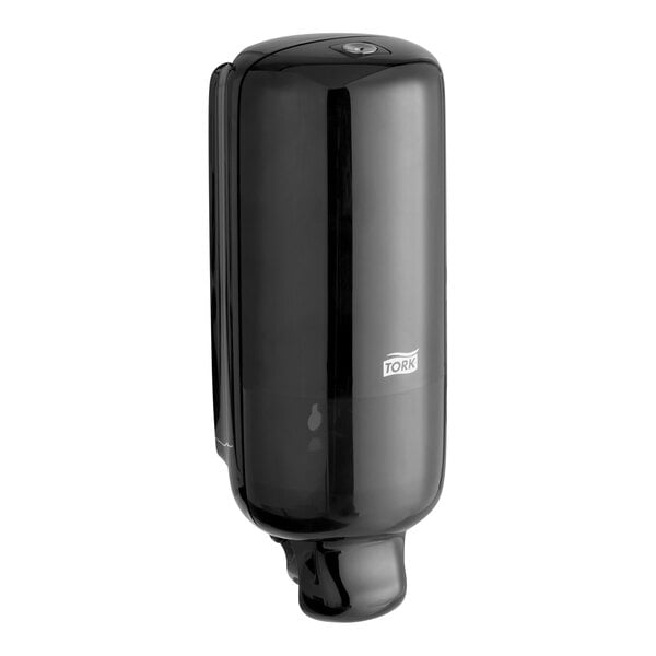 A black Tork manual foam soap dispenser.