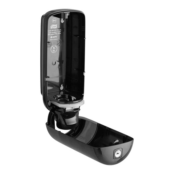 A black plastic Tork foam soap dispenser with a lid open.