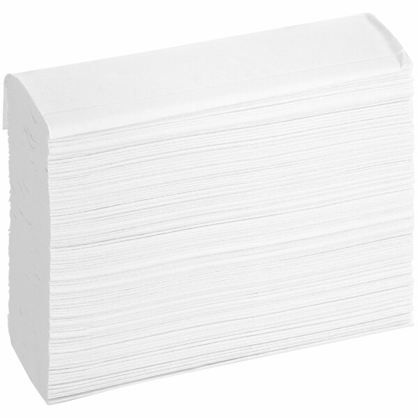 A stack of Tork white multi-fold paper towels.