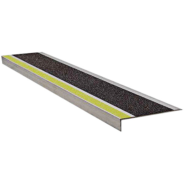 A Wooster metal stair tread with yellow stripes on the surface.