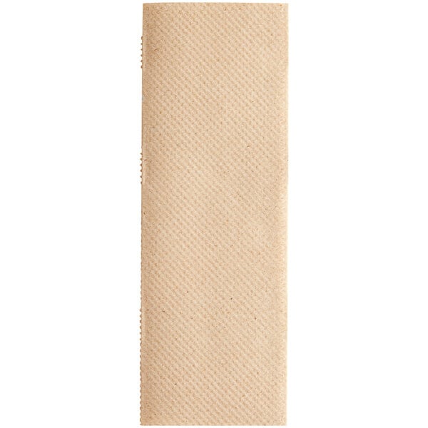 A close-up of a beige Tork multi-fold paper towel.