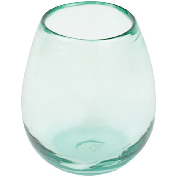 A clear glass with a green rim.