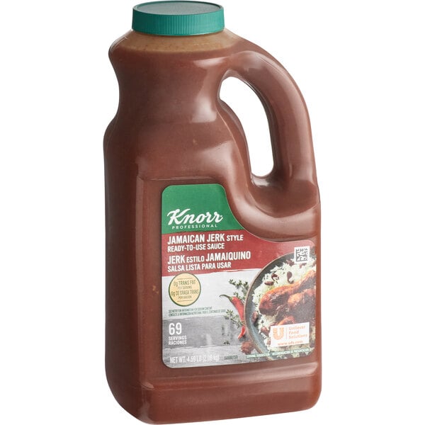 A brown plastic jug of Knorr Jamaican Jerk Sauce with a handle and a label.