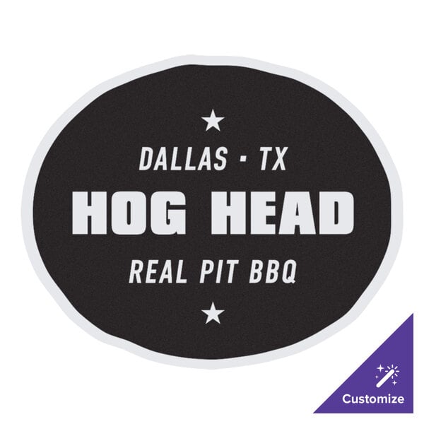 A black and white rectangular sticker with white text that reads "Dallas Texas" and "Hog Head Real Pit Bull" on a table in a butcher shop.