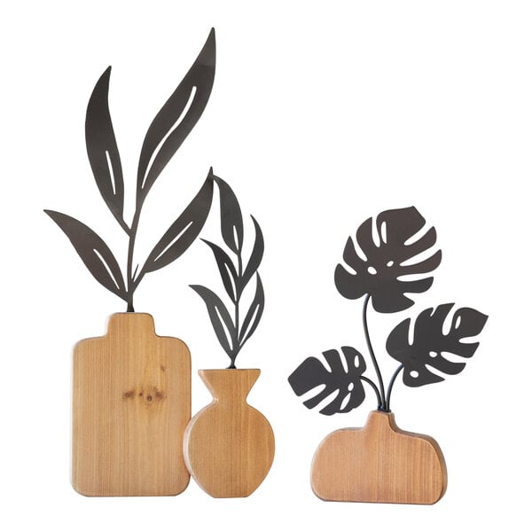 A group of wooden vases with leaves.