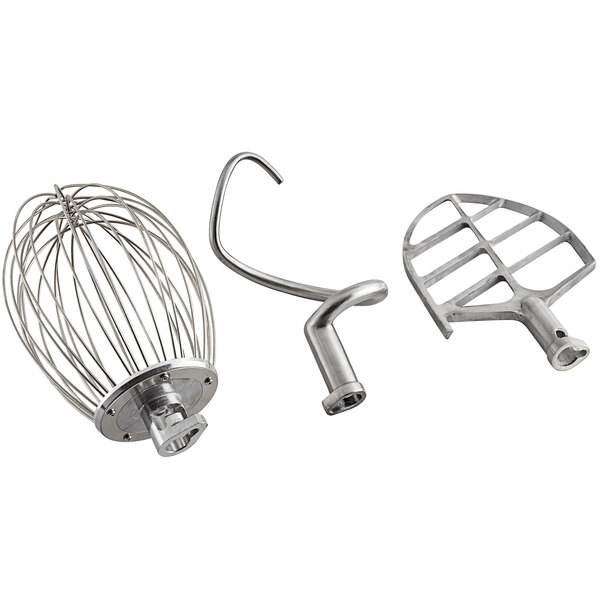 A group of metal MainStreet Equipment mixer parts including three metal wire whiskers and a metal bowl.