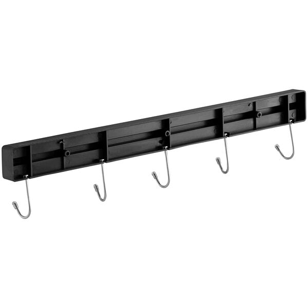 A black rectangular metal knife holder with metal rods and hooks.