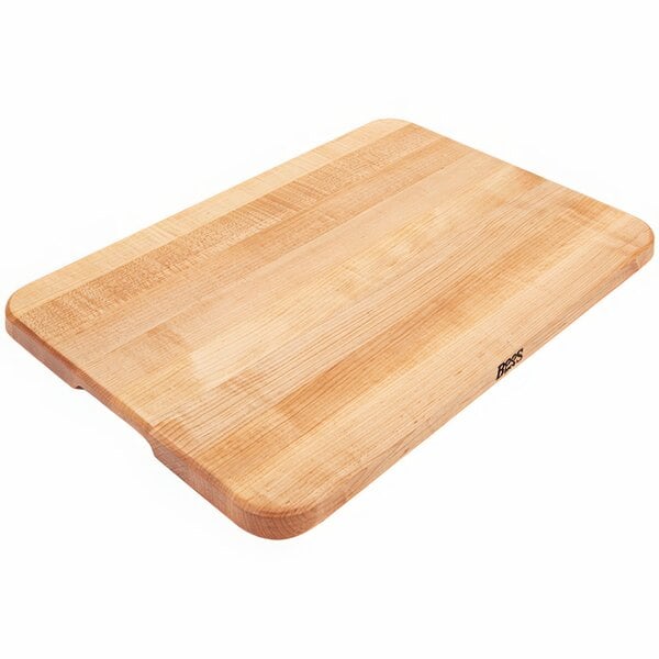 A John Boos maple wood cutting board on a table.