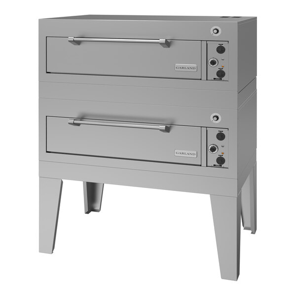 A double deck electric pizza oven with stainless steel construction and control knobs on the right side.