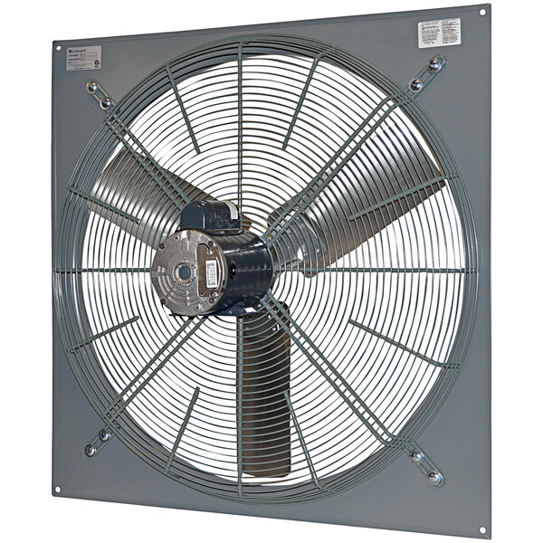 A Canarm 36" panel-mounted industrial fan with a round metal blade.