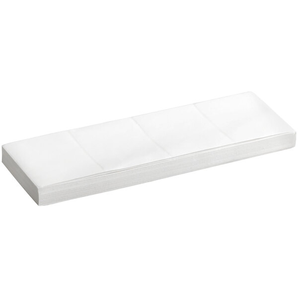 A stack of white Lavex fanfold labels.