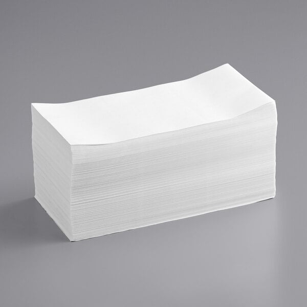 A stack of Lavex white thermal transfer fanfold labels.