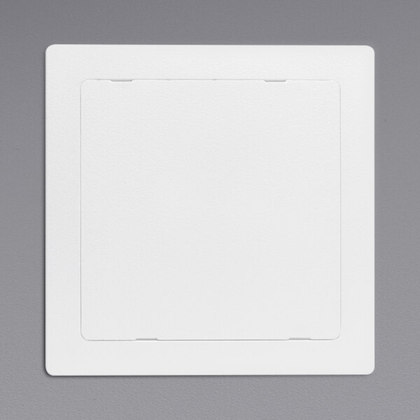 A white square Oatey plastic access panel on a gray background.