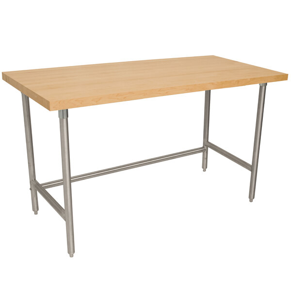 An Advance Tabco wood top work table with a stainless steel base.