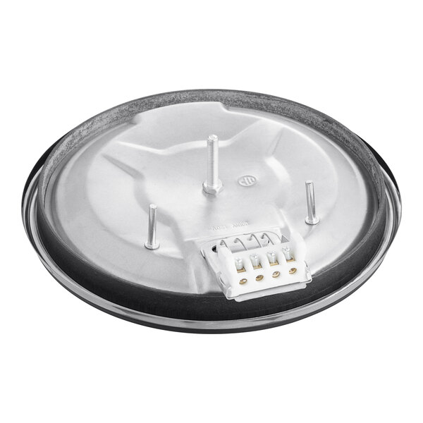 A round metal plate with a black ring and a white base.