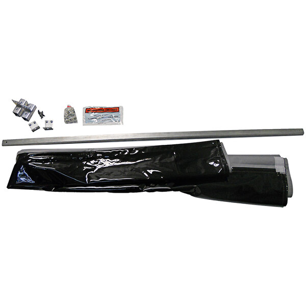 A black plastic bag containing a Singer Safety Weld-Vision Industrial Welding Curtain with metal rings.