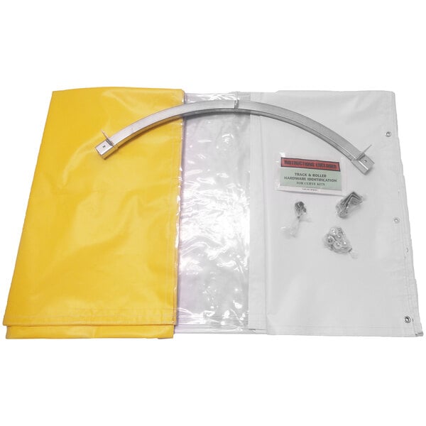 A yellow tarp with a metal bar and a metal curved object on a white surface.