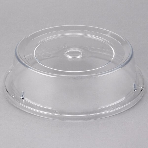 A clear plastic Cambro Camwear plate cover with a circular hole.