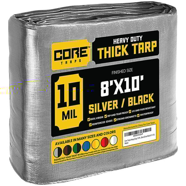 A large roll of Core silver and black heavy-duty weatherproof tarp with reinforced edges.