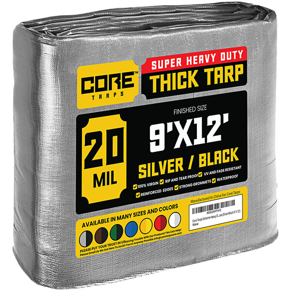 A roll of Core silver and black heavy-duty weatherproof tarp with reinforced edges.