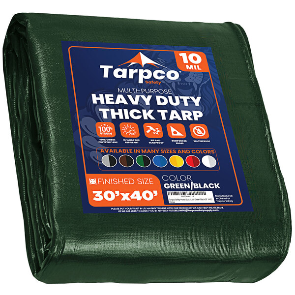 A green Tarpco heavy-duty industrial tarp with blue and white text.