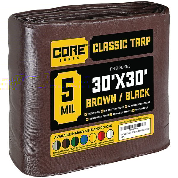 A brown Core Classic weatherproof tarp with reinforced edges in plastic packaging.
