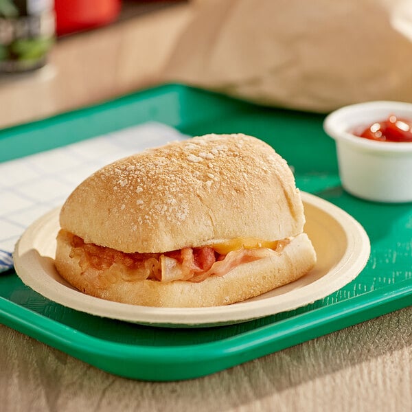 A Grand Prairie Applewood Bacon, Egg, and Gouda Ciabatta Sandwich on a plate.