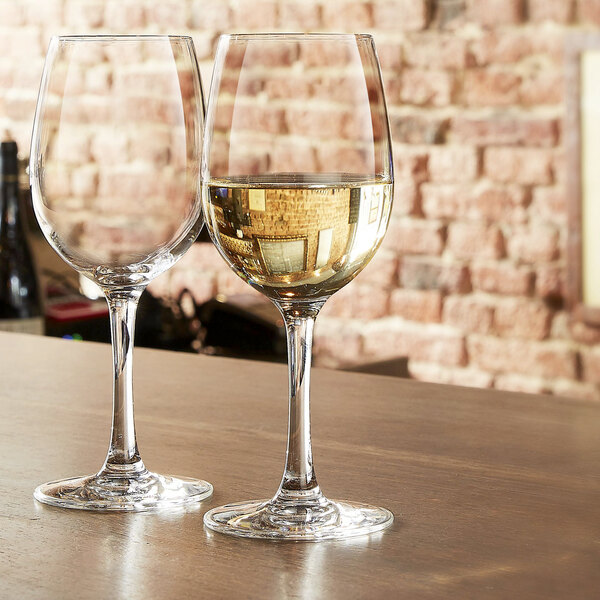 Two Chef & Sommelier tall wine glasses on a table.