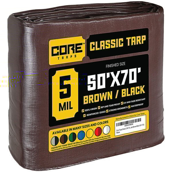 A brown Core Classic weatherproof tarp with reinforced edges in plastic packaging.