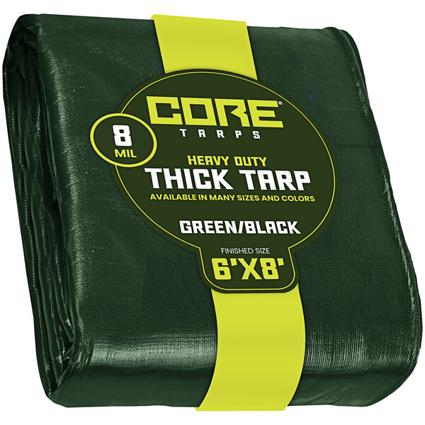 A green Core heavy-duty tarp with reinforced edges and a yellow label.