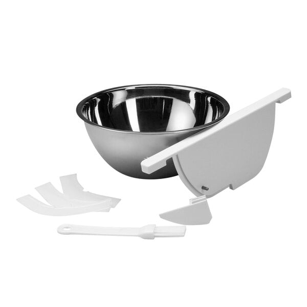 An accessory kit for the ChocoVision Revolation 2, including a stainless steel bowl and various white plastic components.
