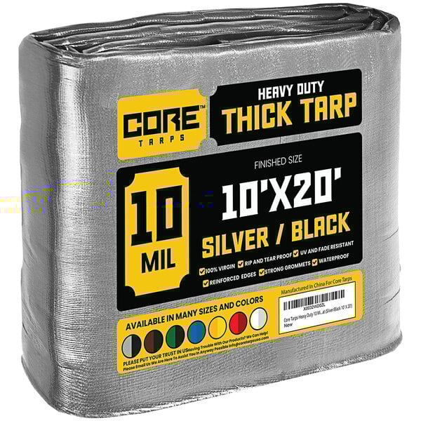 A large roll of Core heavy-duty weatherproof tarps in black and silver packaging.