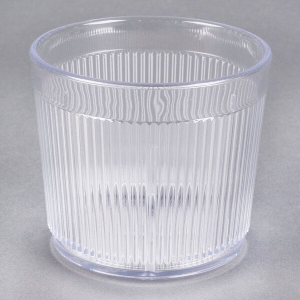 A Carlisle clear plastic tumbler with a ribbed bottom.