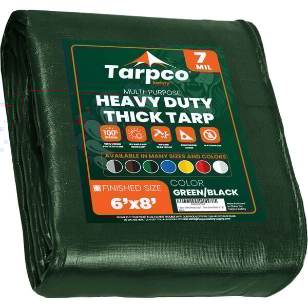 A green Tarpco heavy-duty weatherproof tarp with white text and reinforced edges.