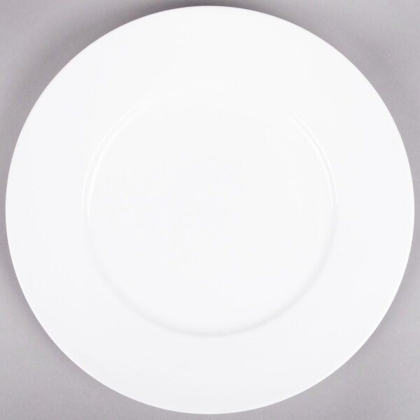 A white Arcoroc Candour porcelain service plate with a white rim.