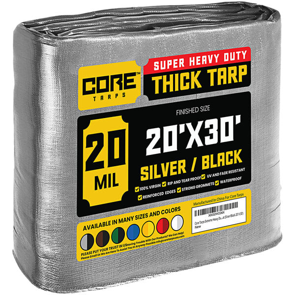 A large roll of Core silver and black heavy-duty tarp with yellow label.