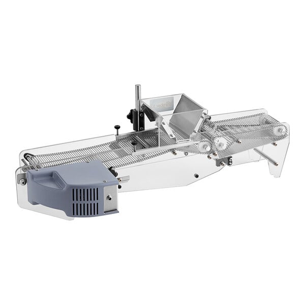 A ChocoVision Delta Enrober with a plastic cover over a conveyor belt.