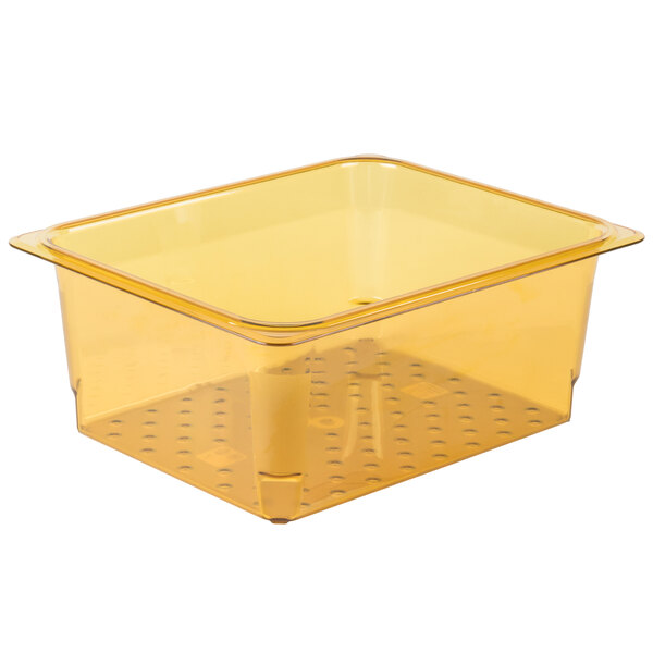 A Cambro amber plastic colander pan with holes in it.