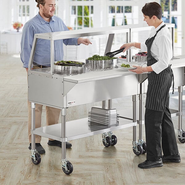 Food handler wearing disposable gloves at a salad bar