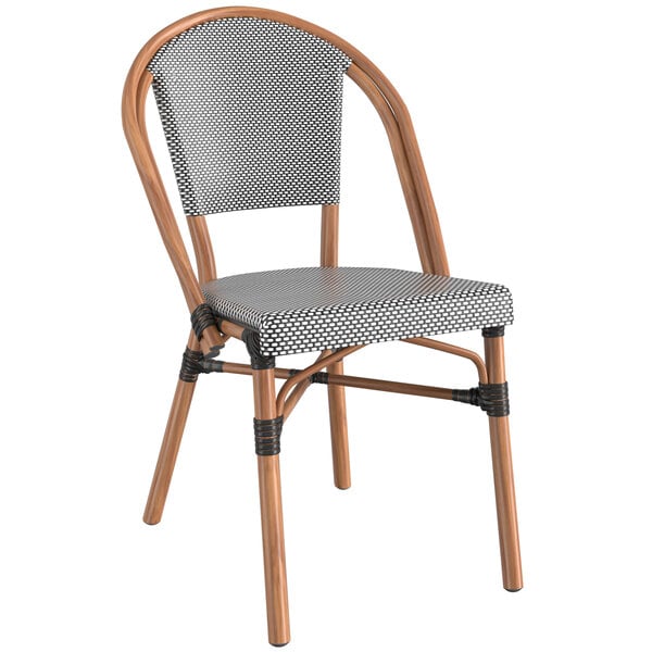 A Lancaster Table & Seating Versilla table with 4 black and white French bistro chairs.